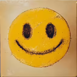 a yellow round object with one eye missing