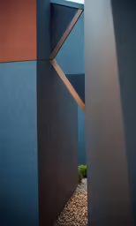 modern sculpture stands alone against a brick wall