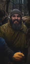 the man is wearing a hat and a beard