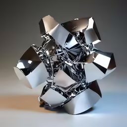 a silver sculpture sitting on top of a table