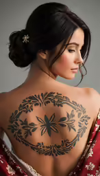 woman in traditional dress with tattoo back view