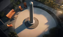 two chairs and a large pillar stand in the middle of the courtyard