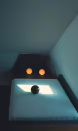 a very simple bed with two small lights in the top