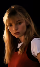 a very pretty blond with a serious look on her face
