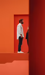 a man and woman standing near each other