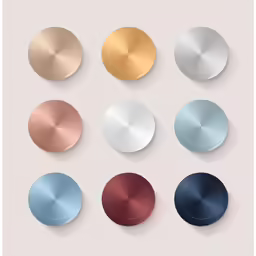 a collection of various metallic discs with a light pink background