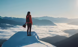 a person standing on a snowy mountain top