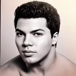 a man wearing very short hair with no shirt on