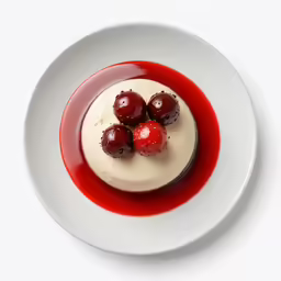 the dessert has cherries and cream on it