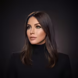 a woman with long brown hair and blue eyes