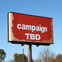 a sign advertising a t shirt store called campaign tbd