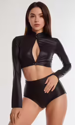 a woman in black leather clothes with no shirt