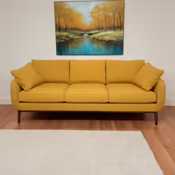 the large painting is next to a yellow couch