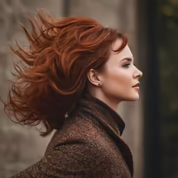 a woman with a red hair looks away