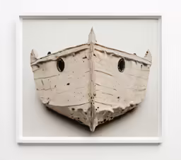 a piece of paper that has been cut out into a boat