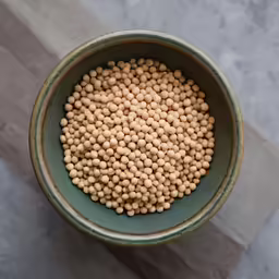 the bowl contains very small brown pearls