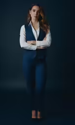 a woman standing with her arms crossed