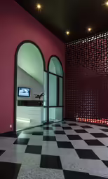 an indoor building with marble floors and pink walls