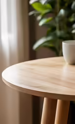 a bowl sits on top of a wooden table