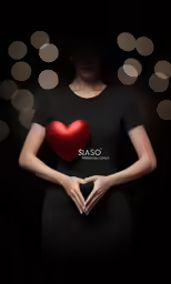 a woman in black dress holding red heart