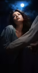 a woman lying on the arm of a mans lap