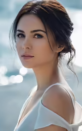 a woman with braid in a white top is by the water