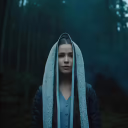the girl in the hooded hood is staring to her right