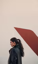 a woman standing with her back to the camera