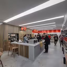 the store is crowded with shoppers and customers