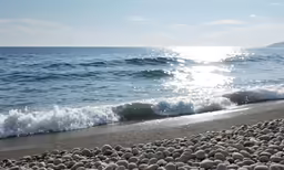the water on the beach is crystal clear