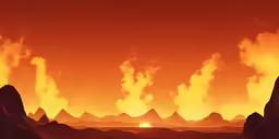 the silhouettes of mountains against an orange sky