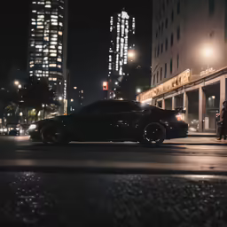 a car in the middle of a city at night