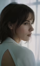 a woman in a white dress with a blue eyes