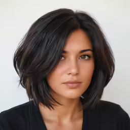 a young woman with a shoulder length bob cut hairstyle
