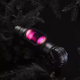 a light is attached to the top of a tree
