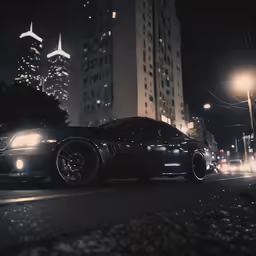 a black car parked on the side of the road in the city at night