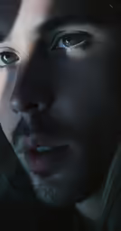 a man with blue eyes looking at the camera