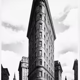the old building with a steeple on the corner has a clock tower at the top