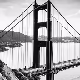 a view of the side of a bridge near the ocean