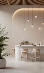 this modern kitchen has white counter tops and a round island with stools