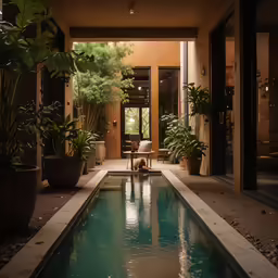 an indoor swimming pool next to a patio