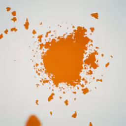 a circle made up of orange powder and some white dots