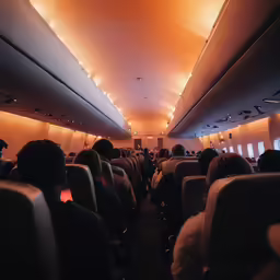 the seats in an airplane with people sitting