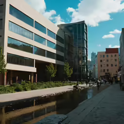 there are people sitting around on benches by a small river