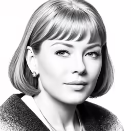 a woman is posing with her face close to the camera