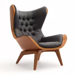 the arm chair is made with wood and black leather