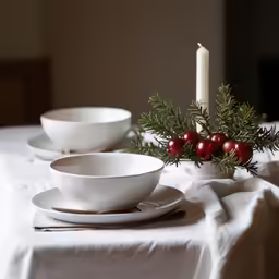 white china on a dining table with christmas decorations
