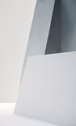 two shapes, a triangle and a column