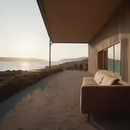 an empty road with a sofa by a large window