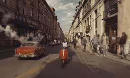 people walking and cars on a street with no traffic
